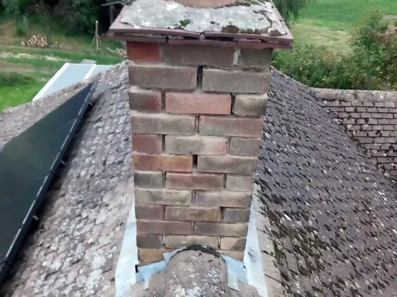 Chimney repair with new lead flashing on a slate roof in Cambridge